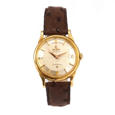 Omega Constellation Pie Pan i 18kt gold with box 
and papers ref. 14382 82SC sold 01.06 1961. 
Calibre 561. D: 34mm